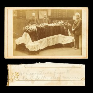 The coffin of British explorer David Livingstone lying in state in the Map Room at the Royal Geographical Society, April 1874, with New Zealand ornithologist Sir Walter Lawry Buller in attendance.