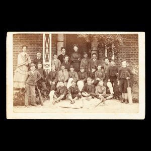 [CRICKET] Outdoor photograph of a group of Melbourne schoolboys and their female tutors, Melbourne, circa 1870.