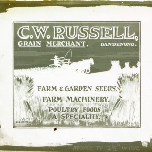 [GLASS CINEMA SLIDE] C. W. Russell, grain merchant, Dandenong. Farm & garden seeds. Farm machinery. Poultry foods a speciality.